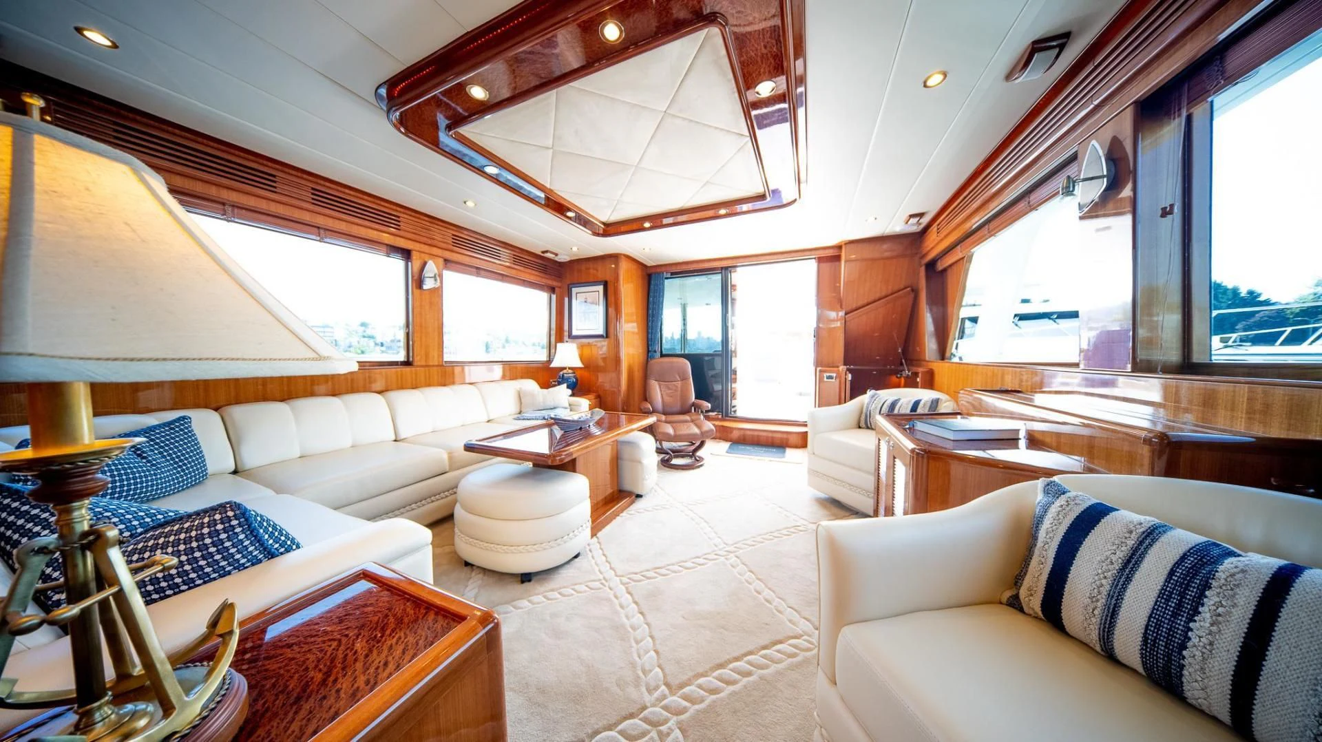 a living room with a large open window aboard SEA CZAR Yacht for Sale