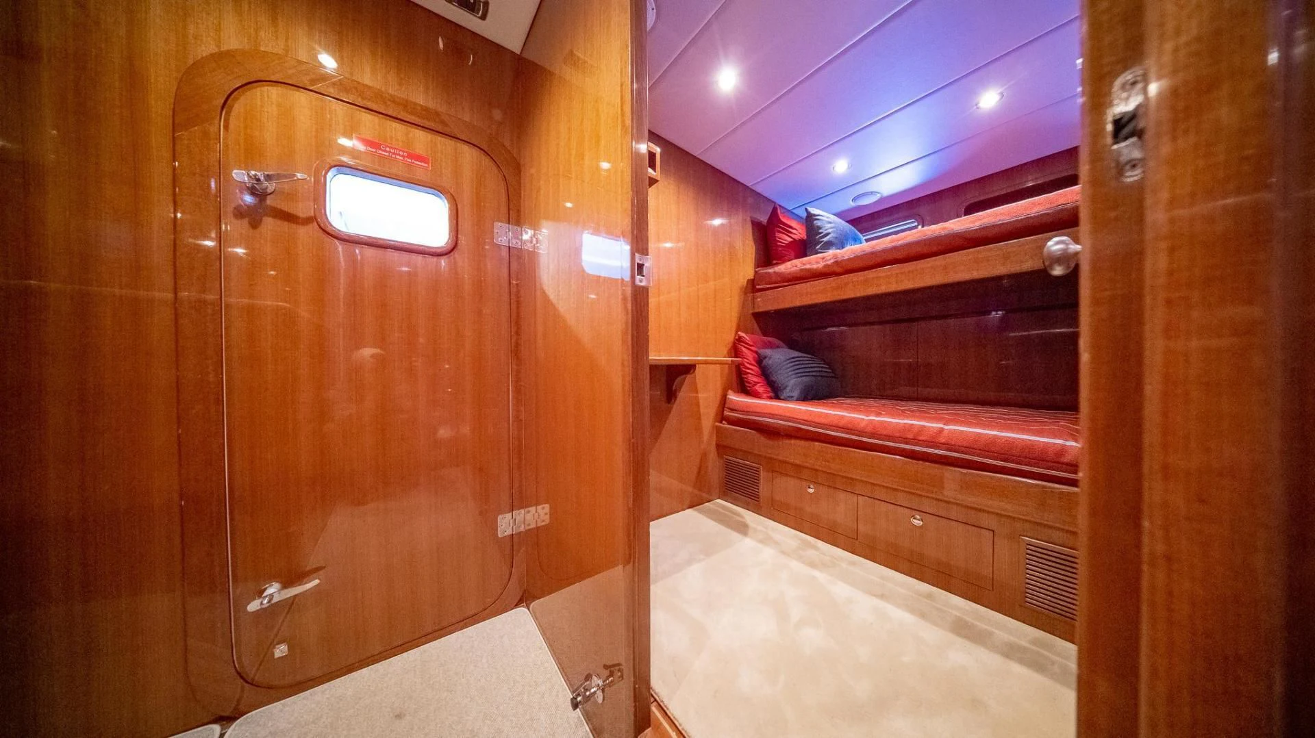 a wooden cabin with a bed aboard SEA CZAR Yacht for Sale