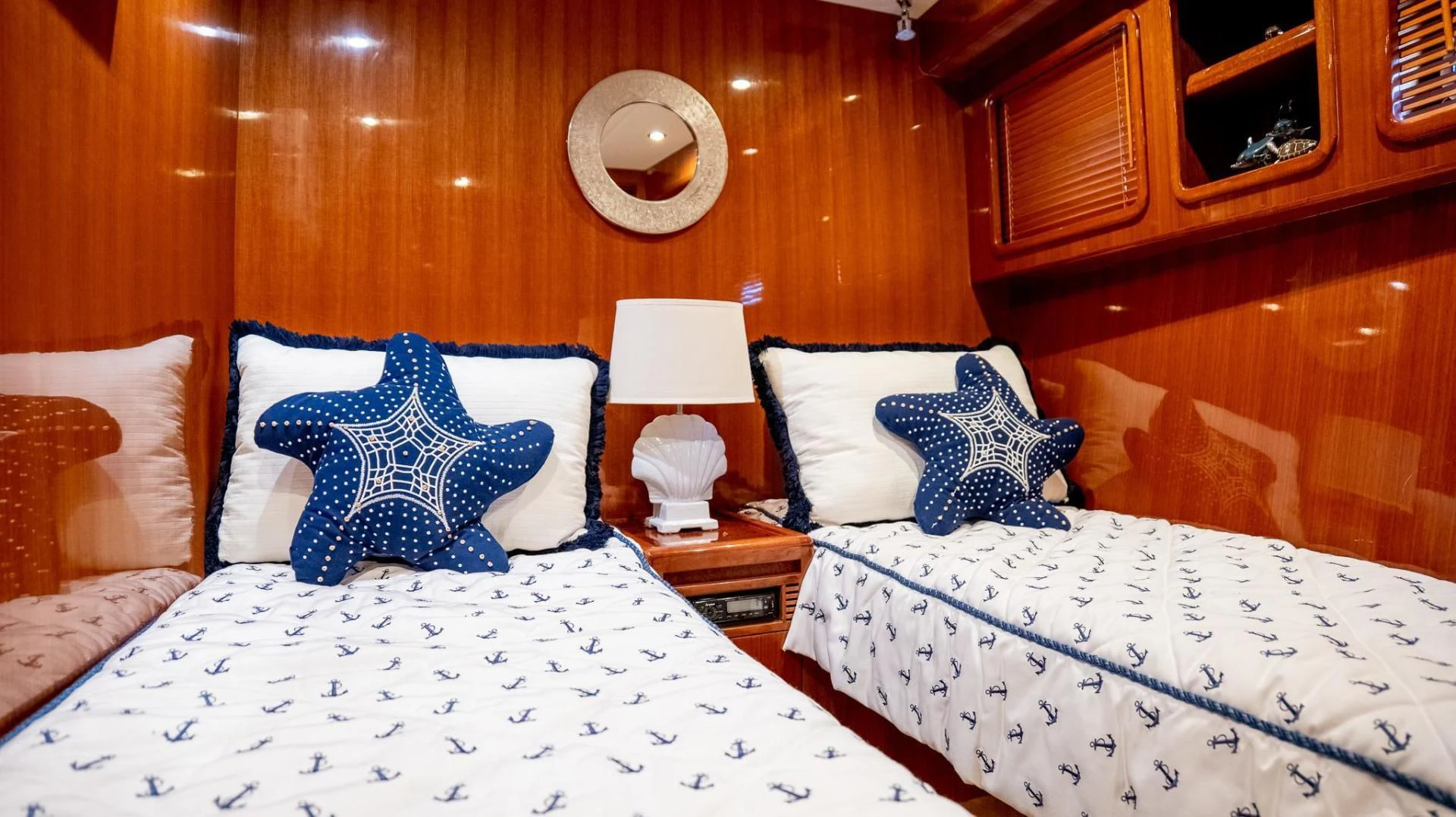 a room with beds and a wood wall aboard SEA CZAR Yacht for Sale