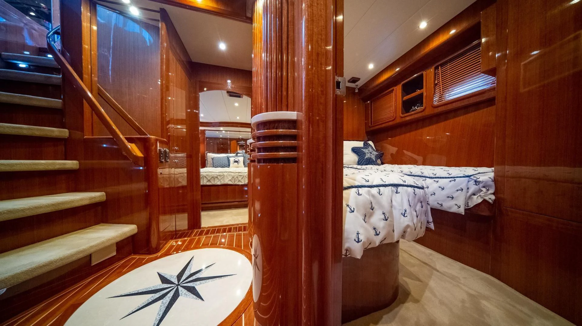 a room with wooden furniture aboard SEA CZAR Yacht for Sale