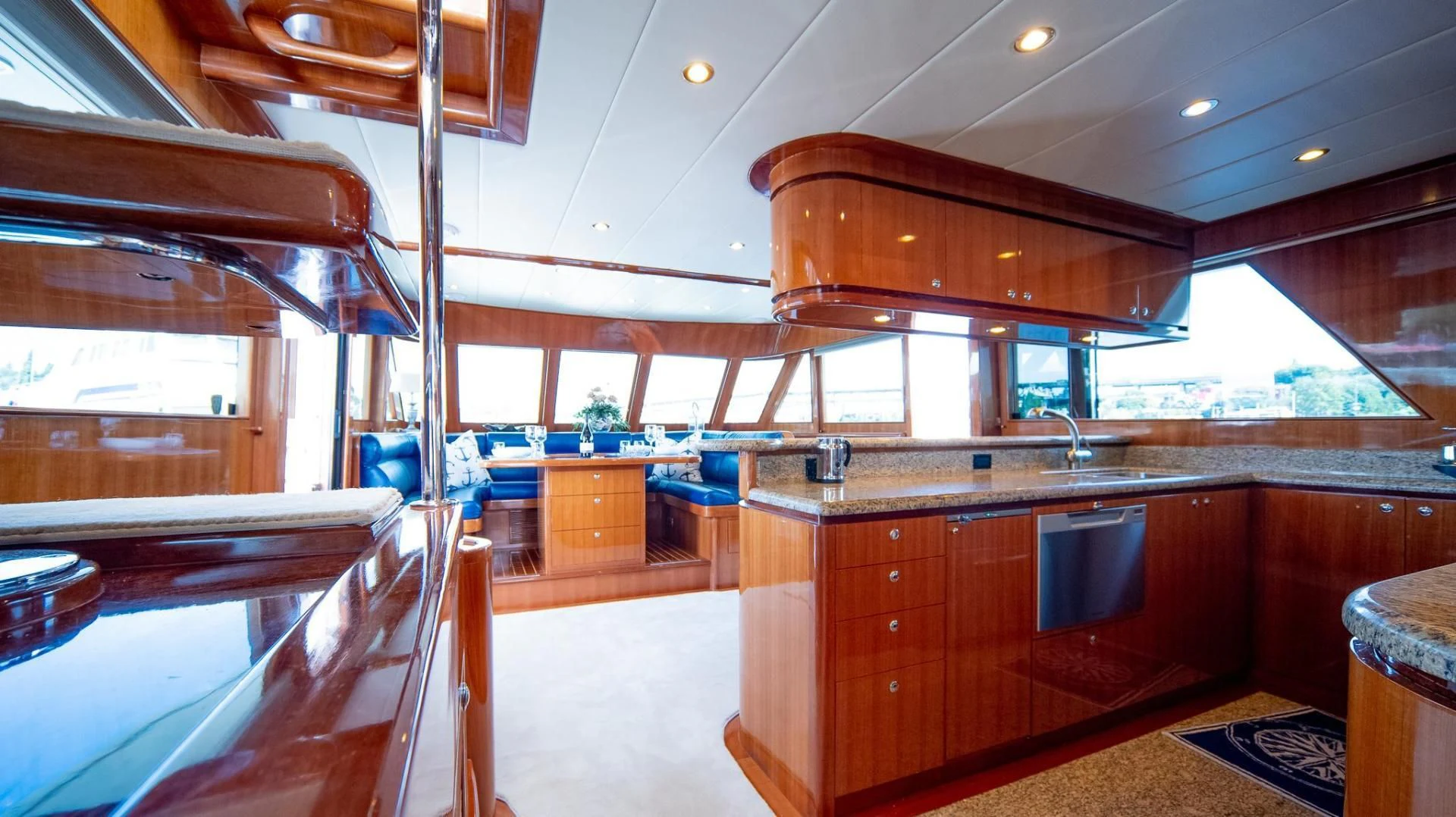 a kitchen with wooden cabinets aboard SEA CZAR Yacht for Sale