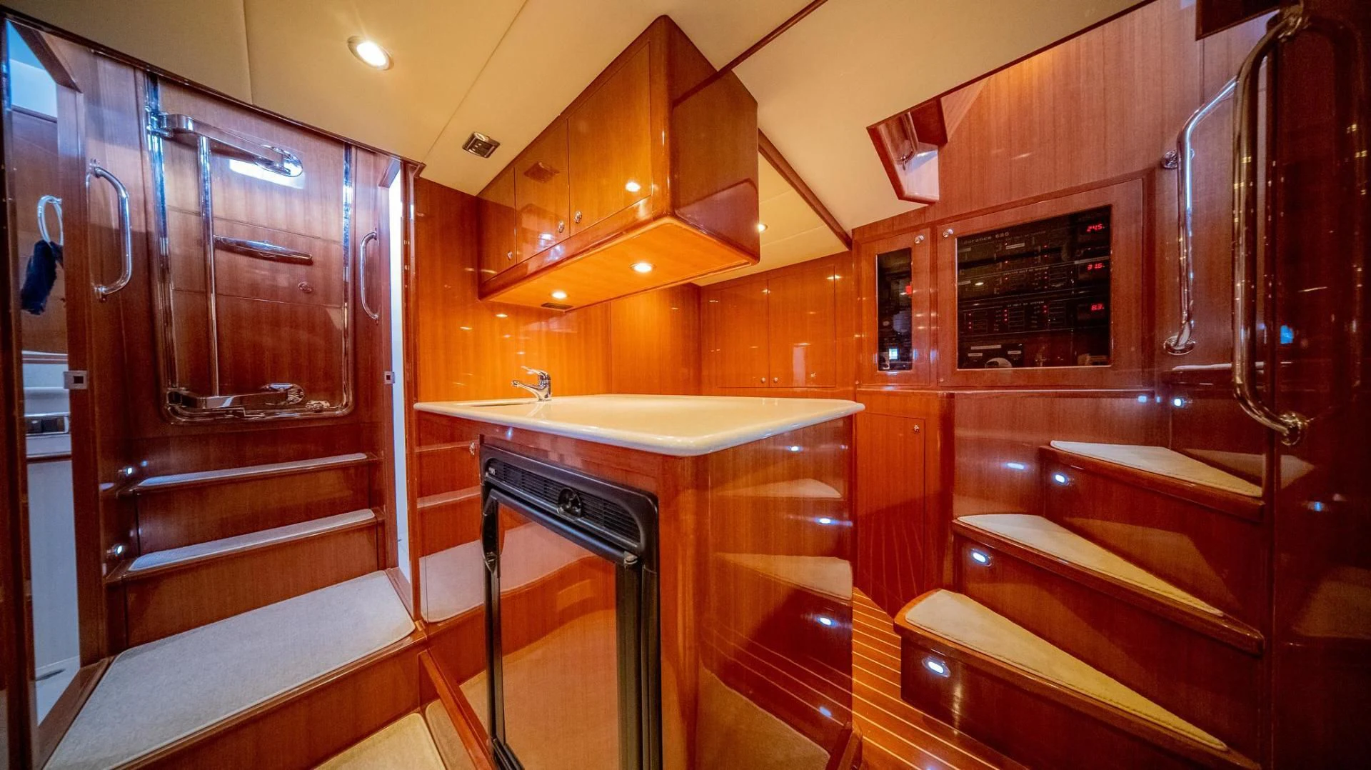 a kitchen with a bar and a bar aboard SEA CZAR Yacht for Sale