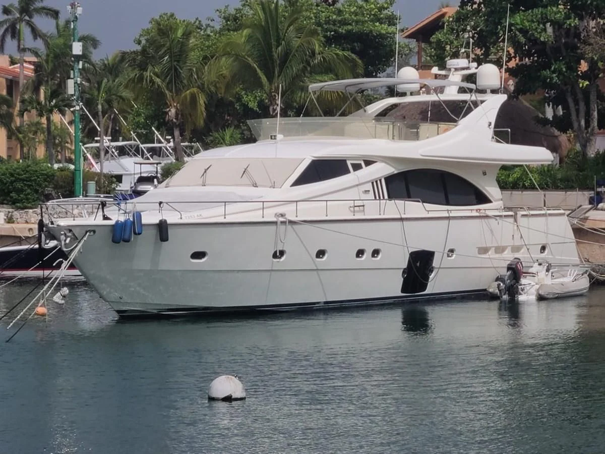 a boat docked at a pier aboard SEDROP - 2006 FERRETTI 731 @ PTO. AVENTURAS Yacht for Sale