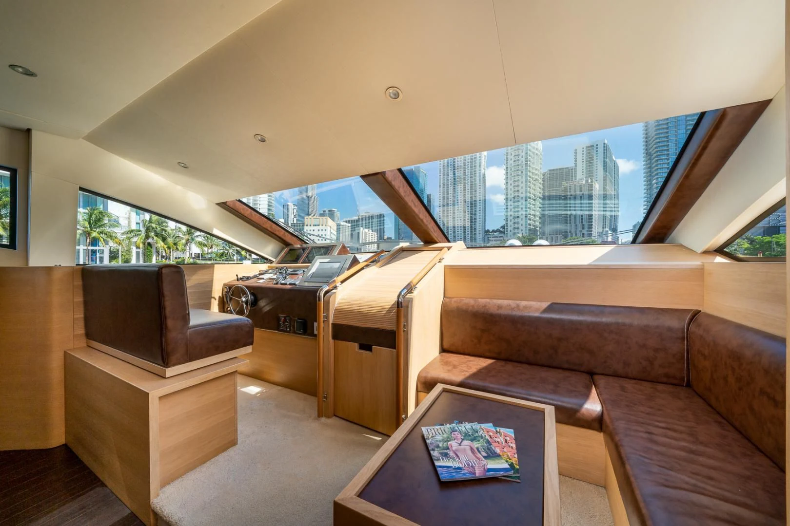 a living room with a couch and a table aboard SEA PEARL 2 Yacht for Sale