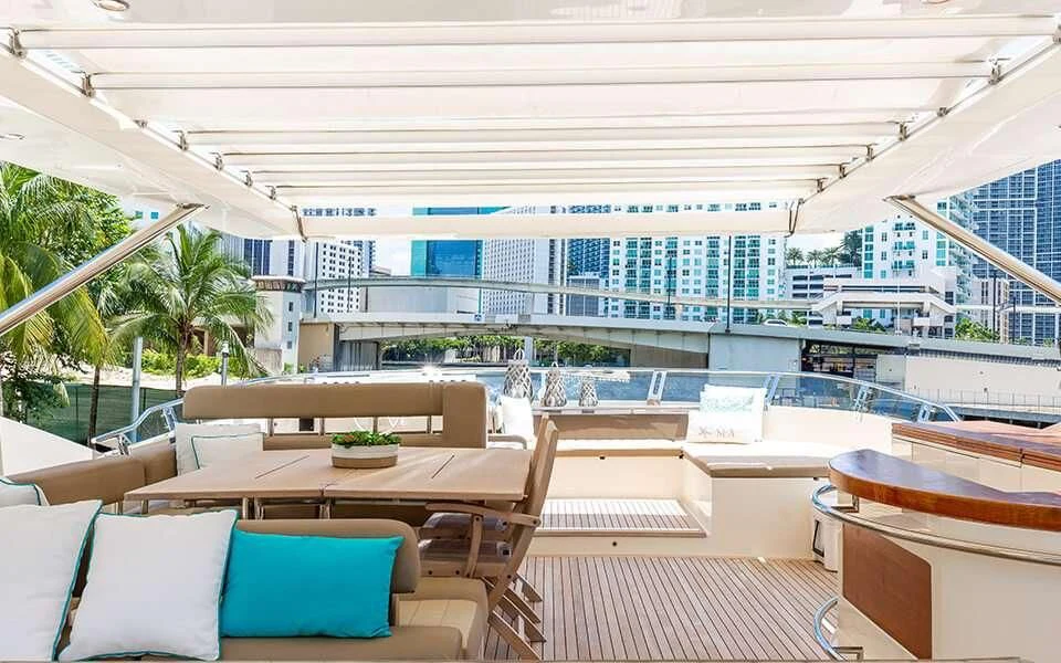 a room with tables and chairs aboard SEA PEARL 2 Yacht for Sale