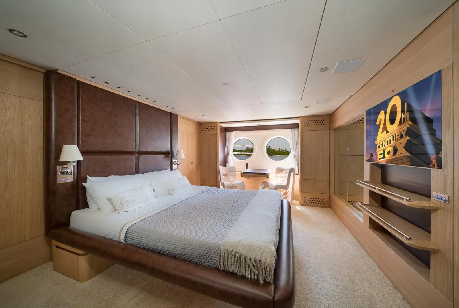 a bedroom with a bed and a desk aboard SEA PEARL 2 Yacht for Sale