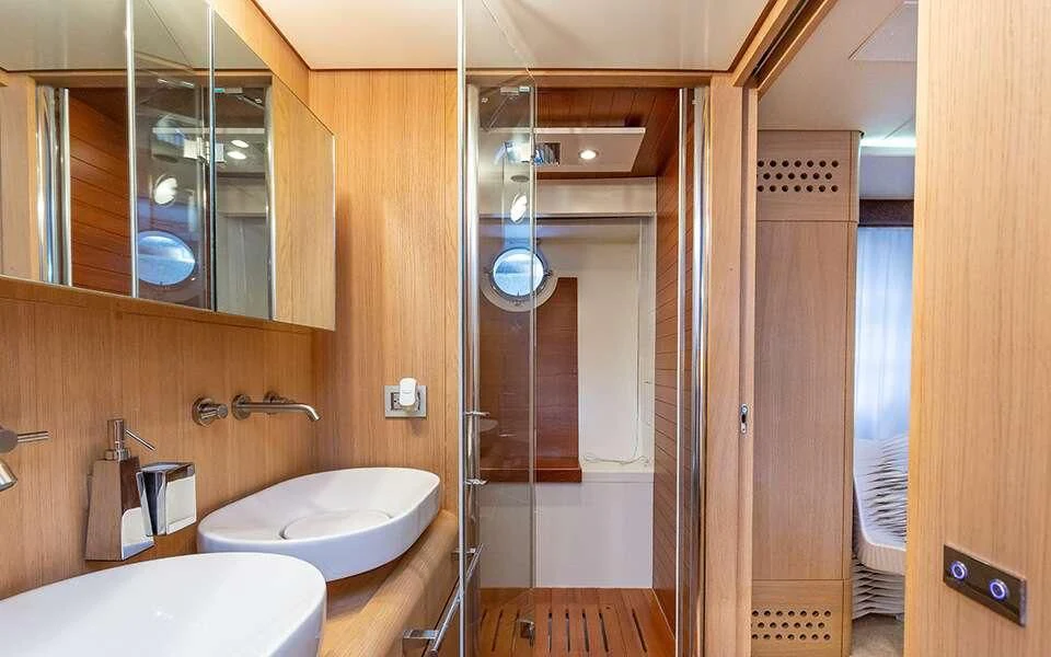 a bathroom with a glass shower aboard SEA PEARL 2 Yacht for Sale
