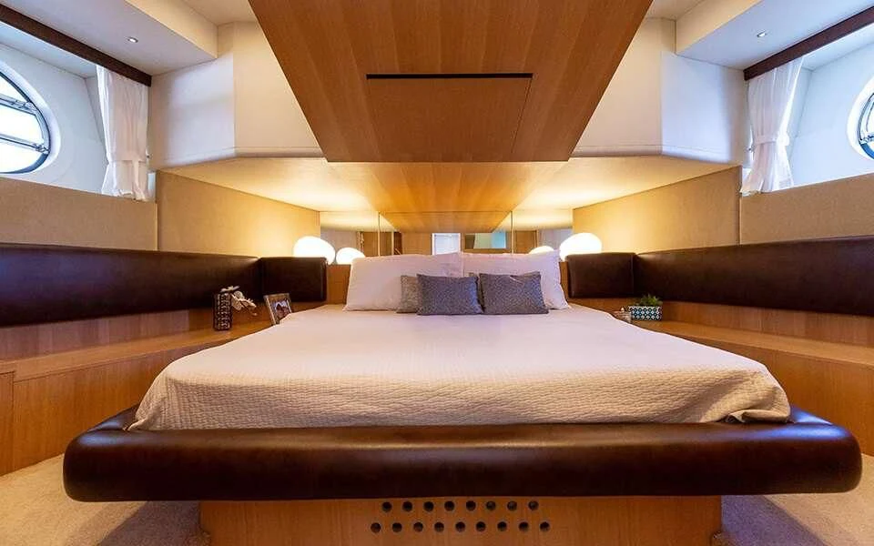 a bed with a couch aboard SEA PEARL 2 Yacht for Sale