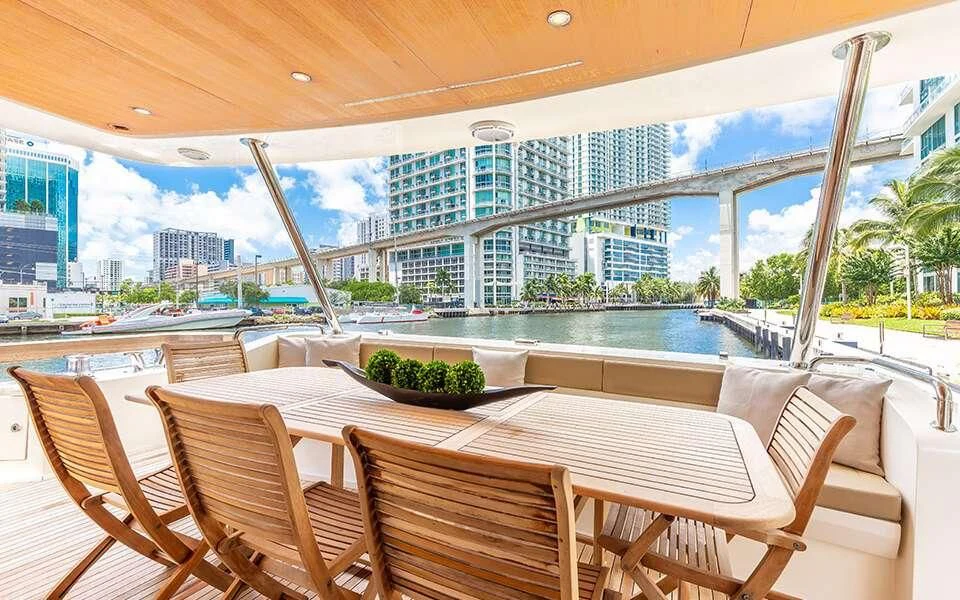 a table and chairs on a patio aboard SEA PEARL 2 Yacht for Sale