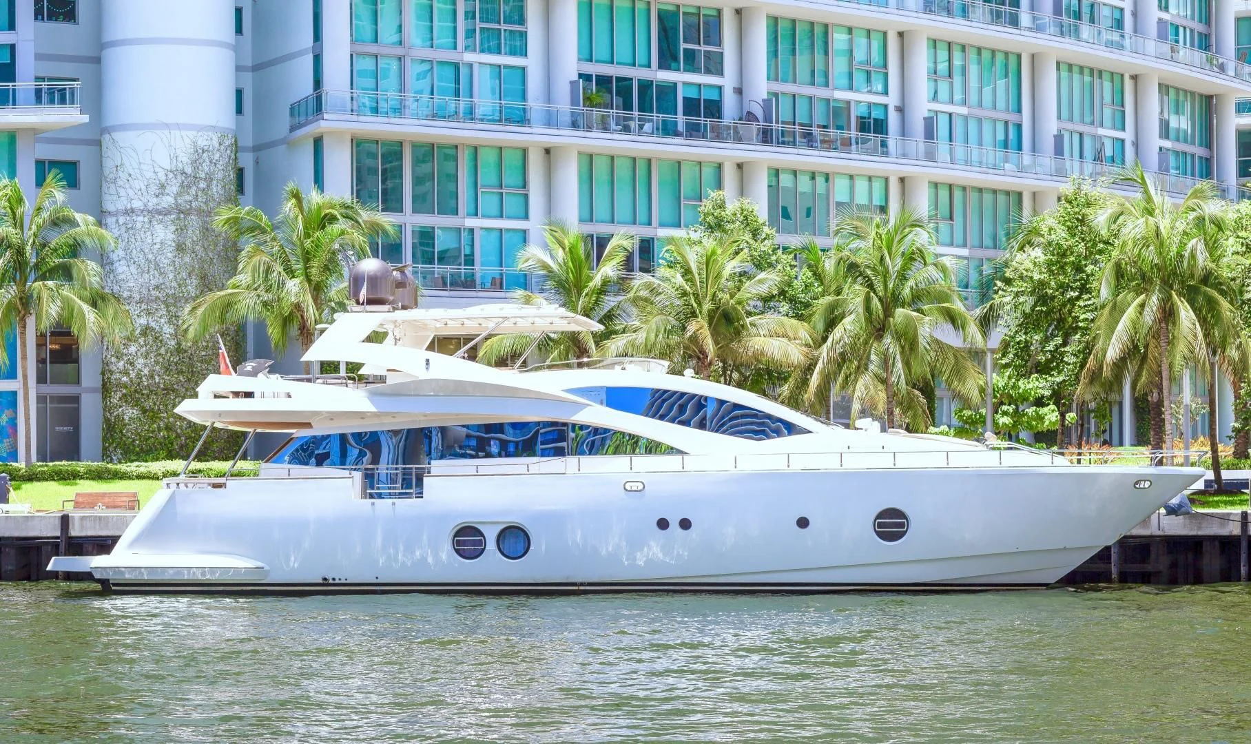 a white yacht in front of a building aboard SEA PEARL 2 Yacht for Sale