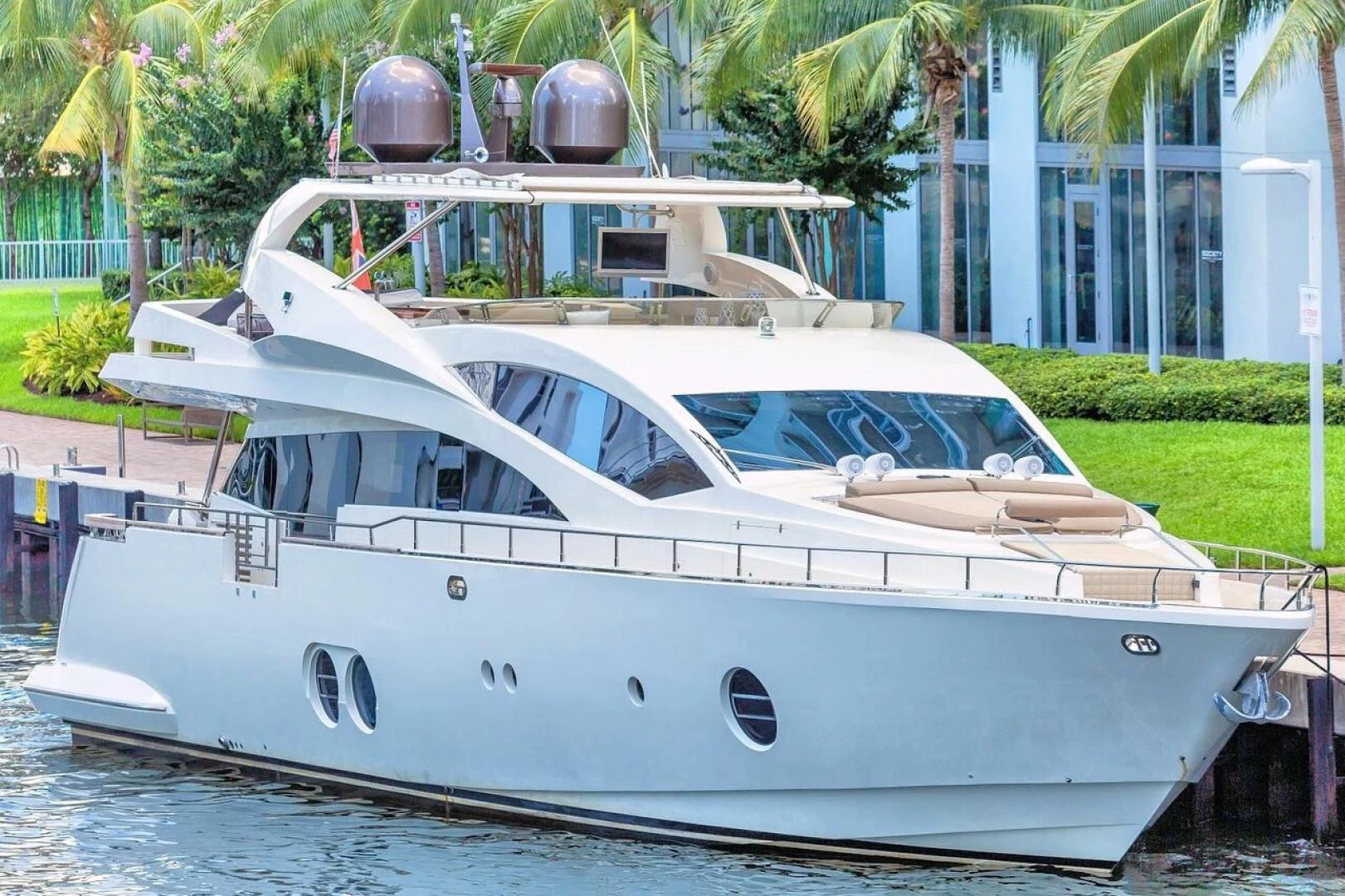 a white yacht on a dock aboard SEA PEARL 2 Yacht for Sale