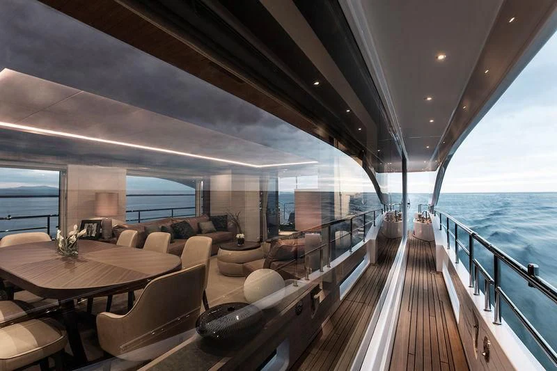 a deck with a large window overlooking a body of water aboard CHRISTELLA II Yacht for Sale