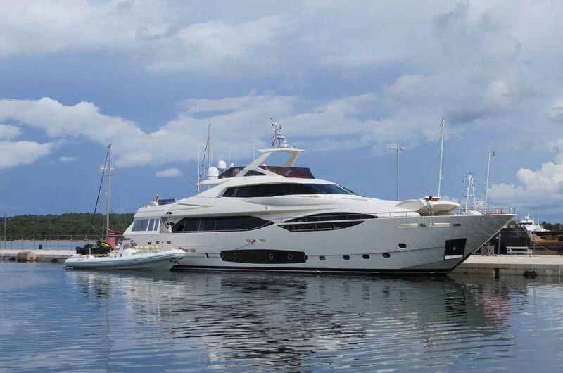 a couple of white yachts in a harbor aboard LAVANDA Yacht for Sale