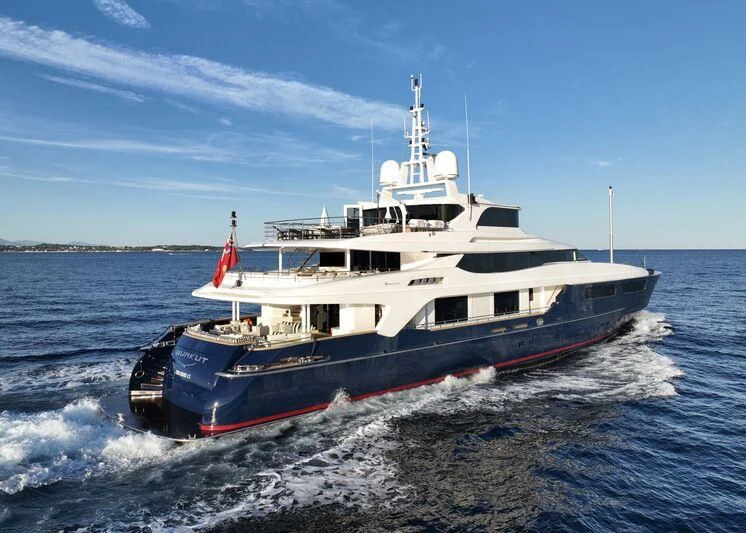 a large boat on the water aboard BURKUT Yacht for Sale