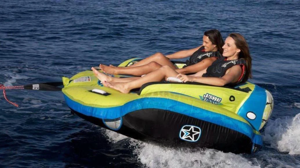 a man and woman on a raft in the water aboard BURKUT Yacht for Sale