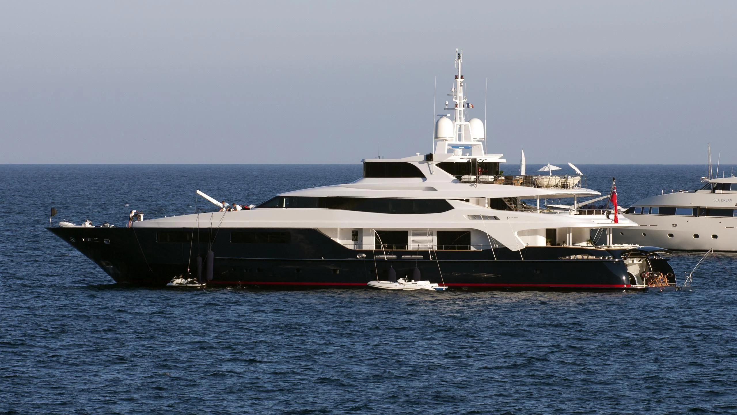 a large ship in the water aboard BURKUT Yacht for Sale