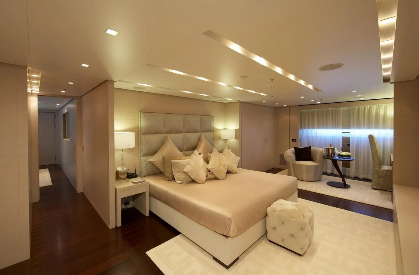 a large living room with a large bed and a large window aboard BURKUT Yacht for Sale
