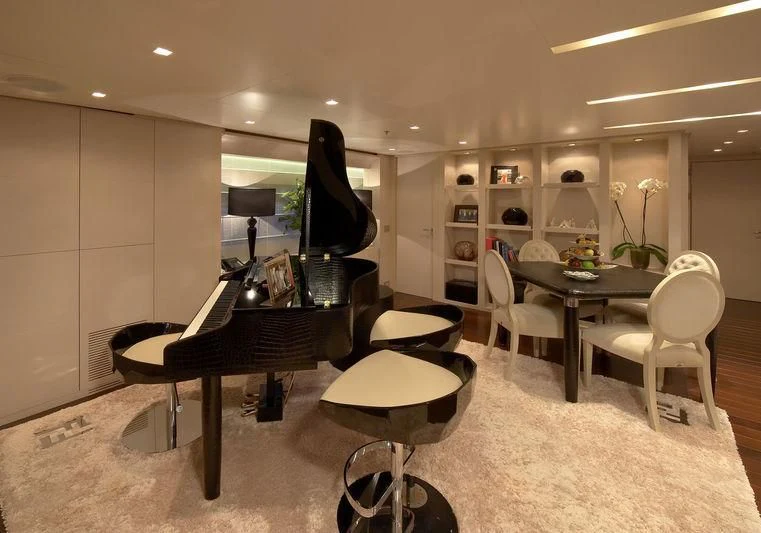 a room with a table and chairs aboard BURKUT Yacht for Sale