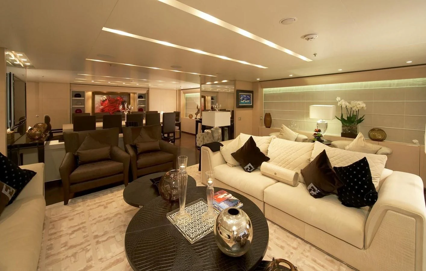 a living room with a white couch and a coffee table aboard BURKUT Yacht for Sale
