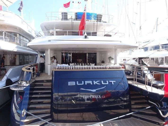 a boat with a flag on the front aboard BURKUT Yacht for Sale