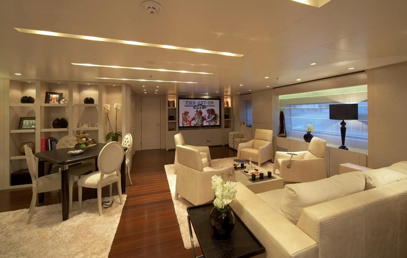 a living room with a large window aboard BURKUT Yacht for Sale
