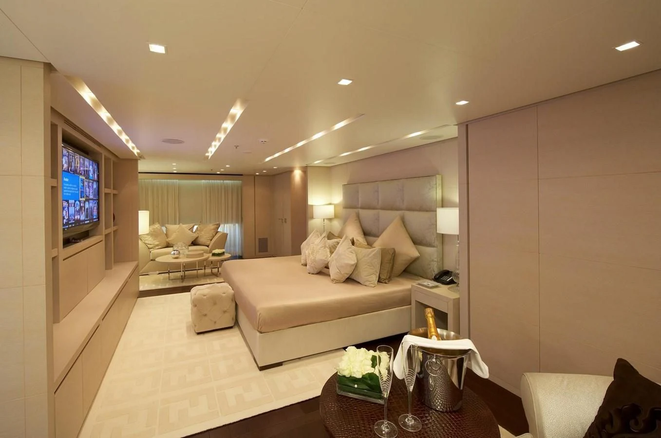 a living room with a large screen aboard BURKUT Yacht for Sale