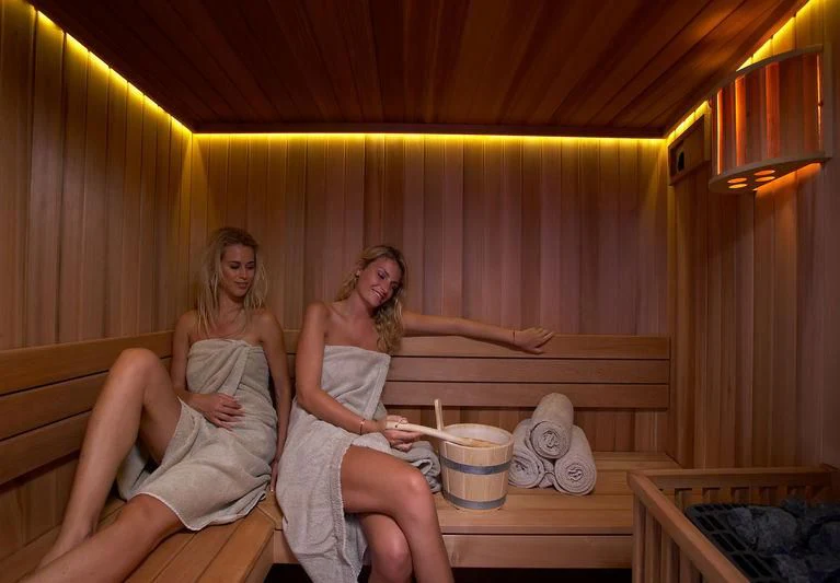 two women sitting on a bed aboard BURKUT Yacht for Sale