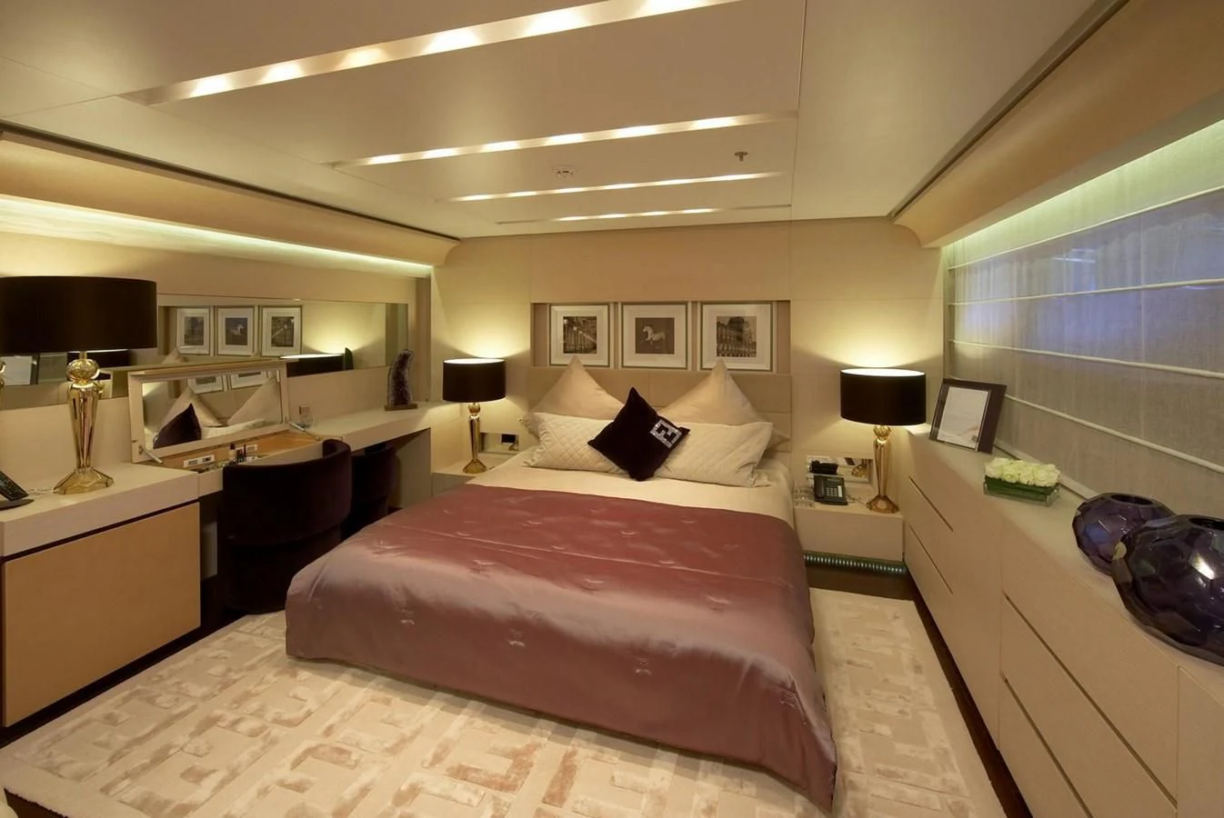 a bedroom with a bed and a desk aboard BURKUT Yacht for Sale