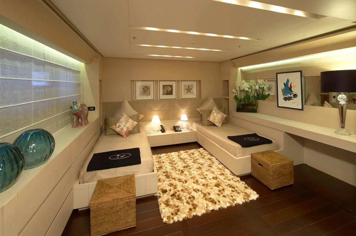 a living room with a couch and a rug aboard BURKUT Yacht for Sale