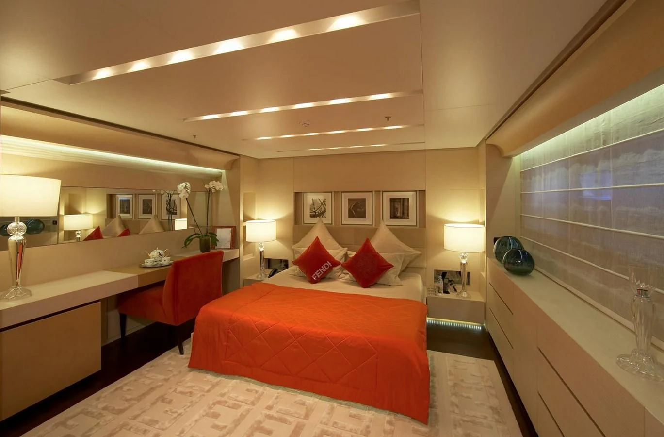 a hotel room with a bed and desk aboard BURKUT Yacht for Sale