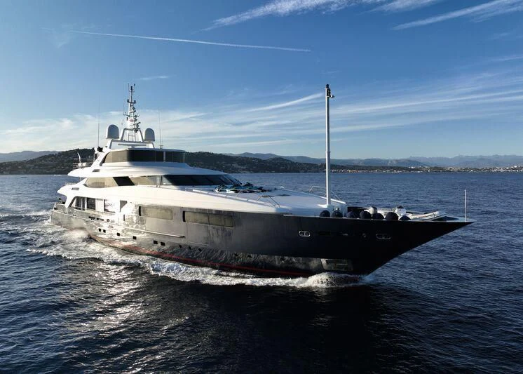 a large white ship in the water aboard BURKUT Yacht for Sale