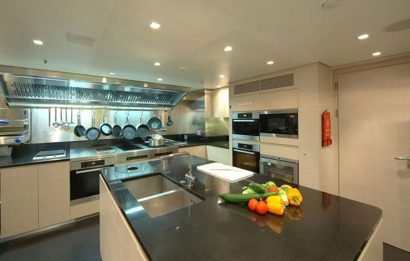 a kitchen with a large island aboard BURKUT Yacht for Sale