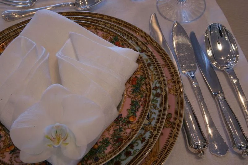 a plate with a napkin and silverware on it aboard BURKUT Yacht for Sale