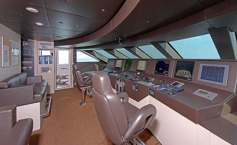 a room with a couch and chairs aboard BURKUT Yacht for Sale