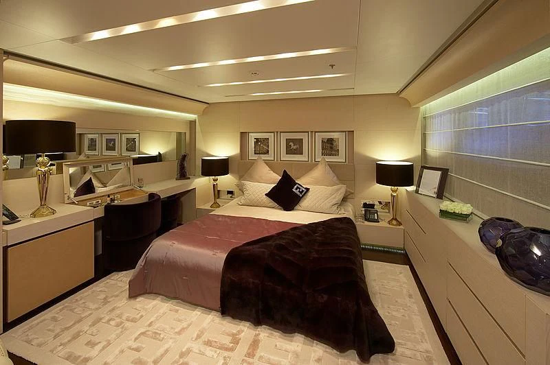 a bedroom with a bed and a desk aboard BURKUT Yacht for Sale