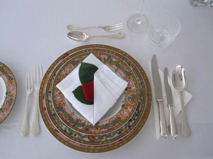 a plate with a napkin and fork on it aboard BURKUT Yacht for Sale