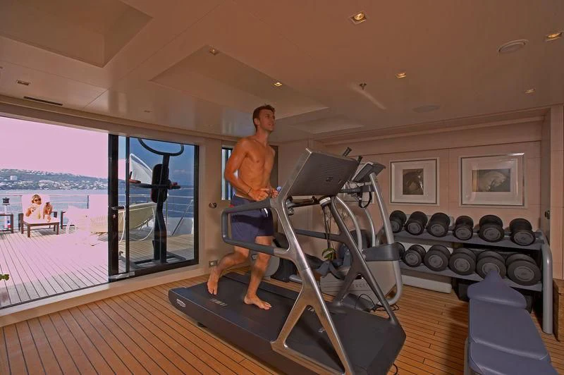 a person working out in a gym aboard BURKUT Yacht for Sale