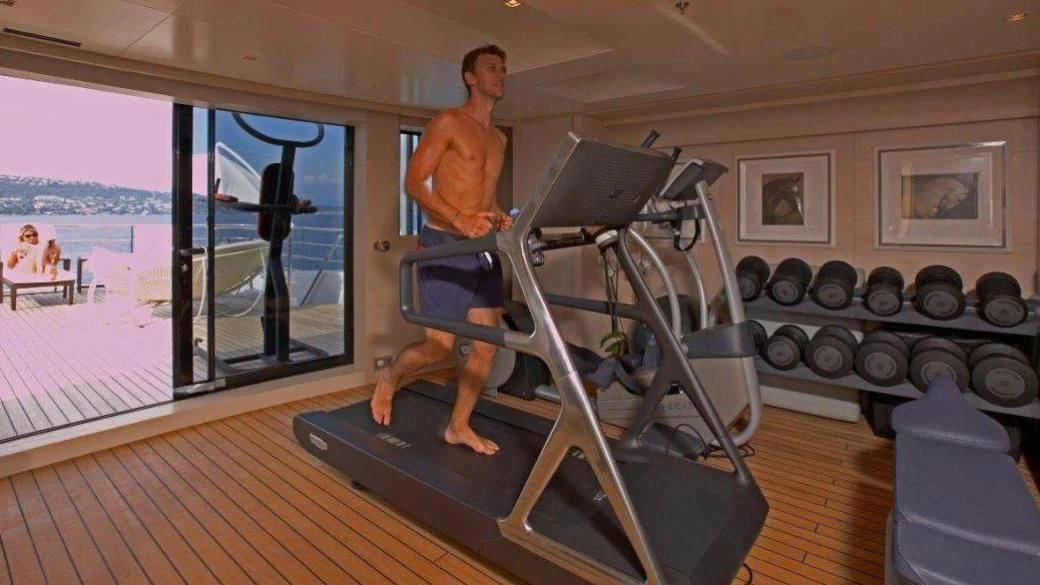 a person on a treadmill aboard BURKUT Yacht for Sale