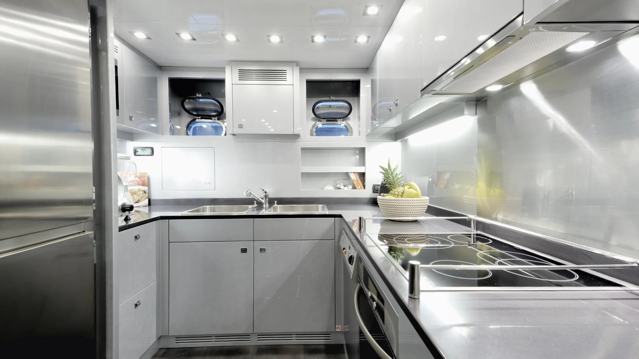 a kitchen with white cabinets aboard CLARISSA Yacht for Sale