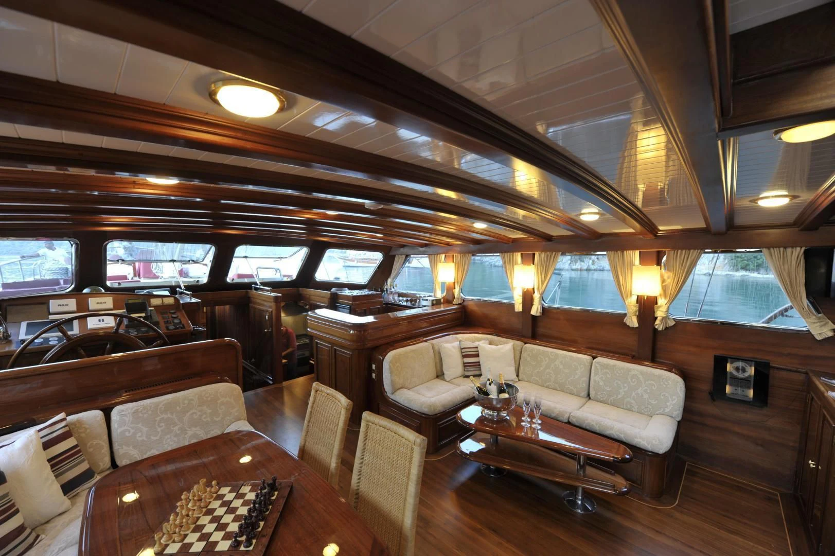 a living room with a wood floor aboard CLARISSA Yacht for Sale