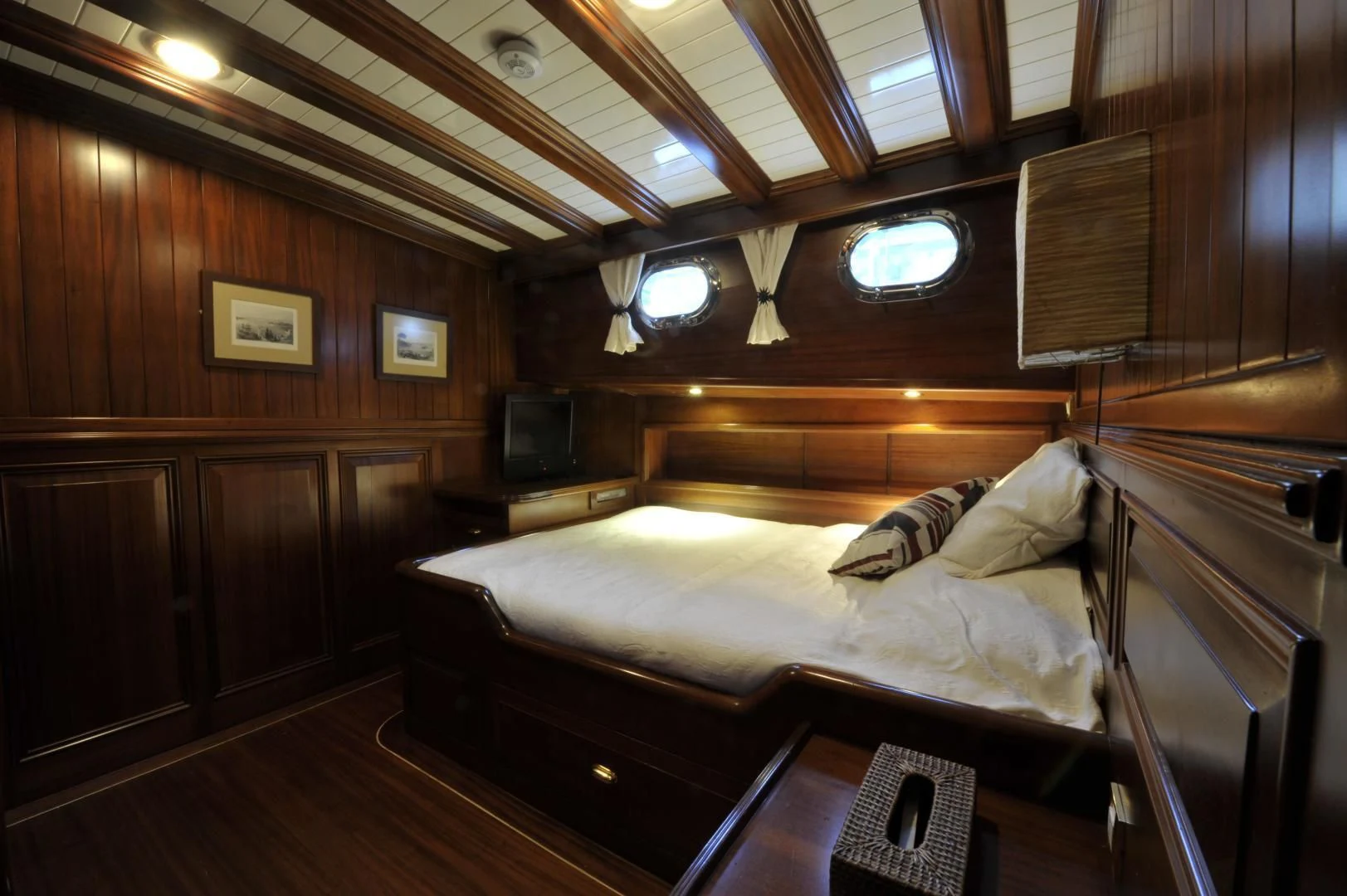 a room with a bed and a wood wall aboard CLARISSA Yacht for Sale