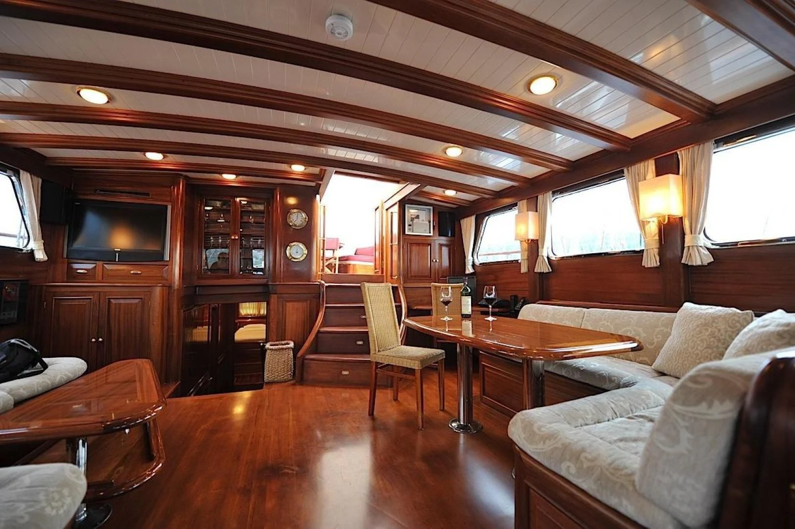 a living room with wood floors aboard CLARISSA Yacht for Sale