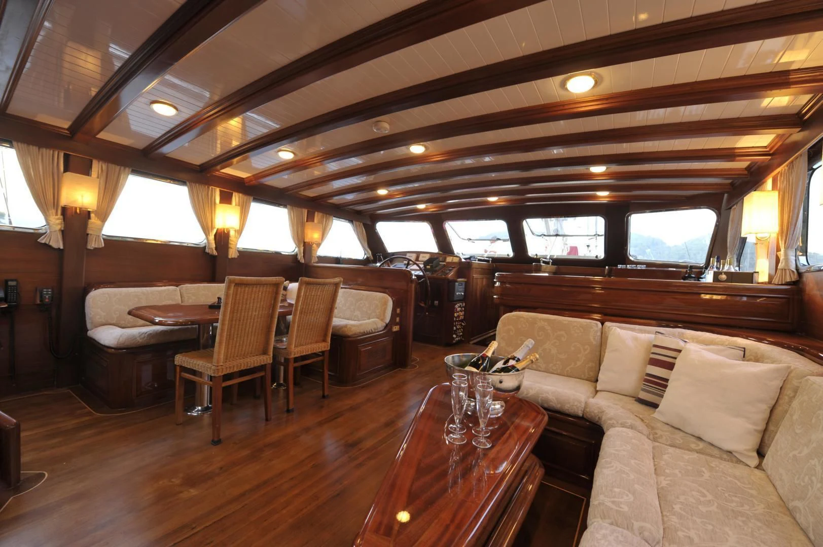 a living room with a wood floor aboard CLARISSA Yacht for Sale