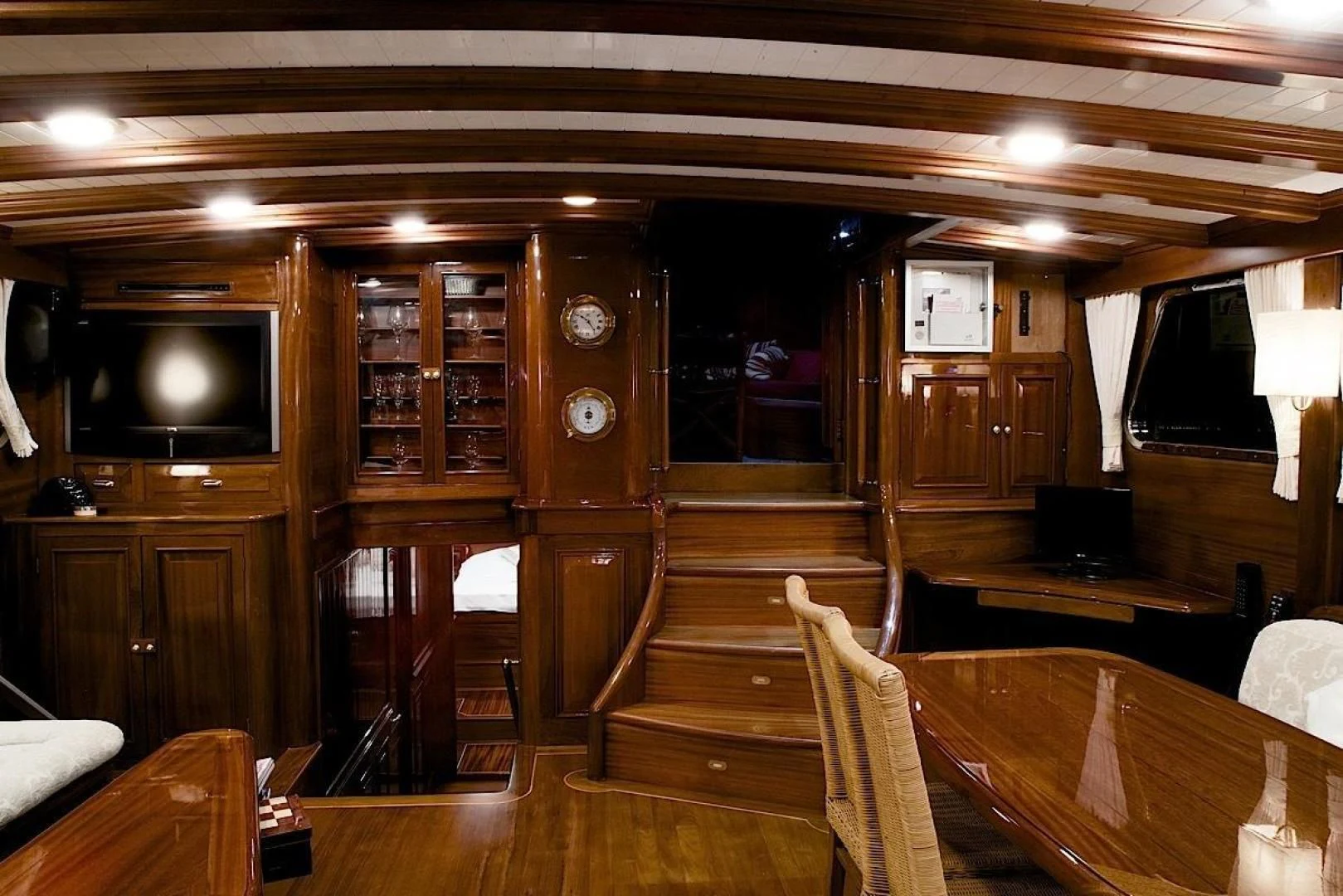 a room with wood cabinets and a television aboard CLARISSA Yacht for Sale