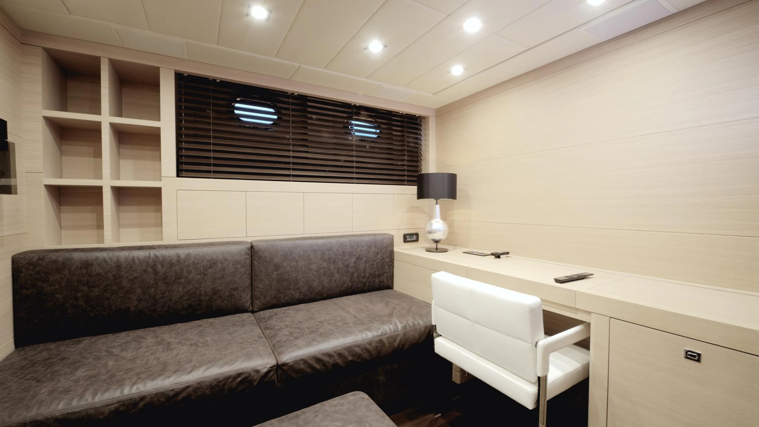 a room with a couch and a desk aboard CLARISSA Yacht for Sale