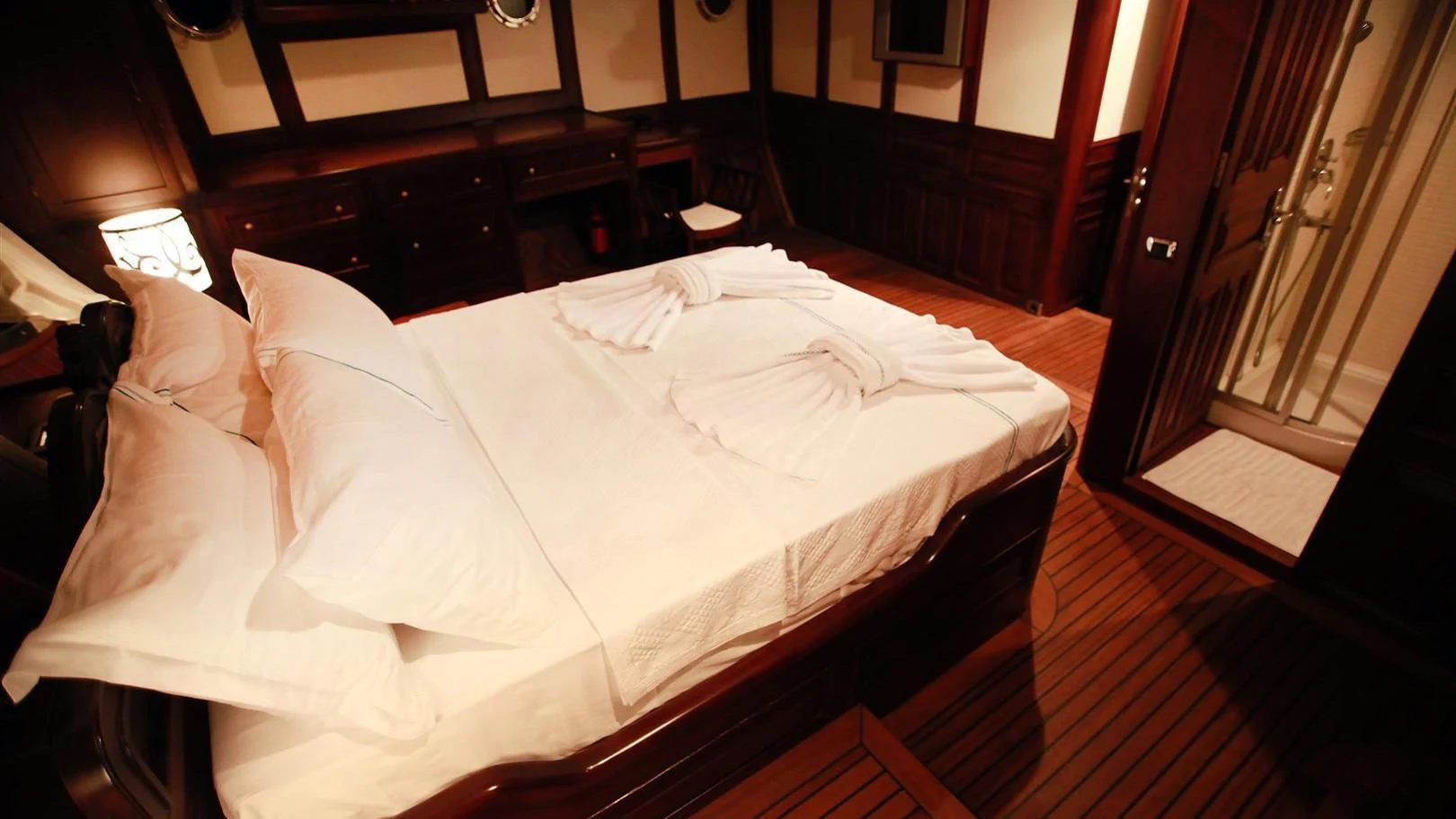 a bed with white sheets aboard CLARISSA Yacht for Sale
