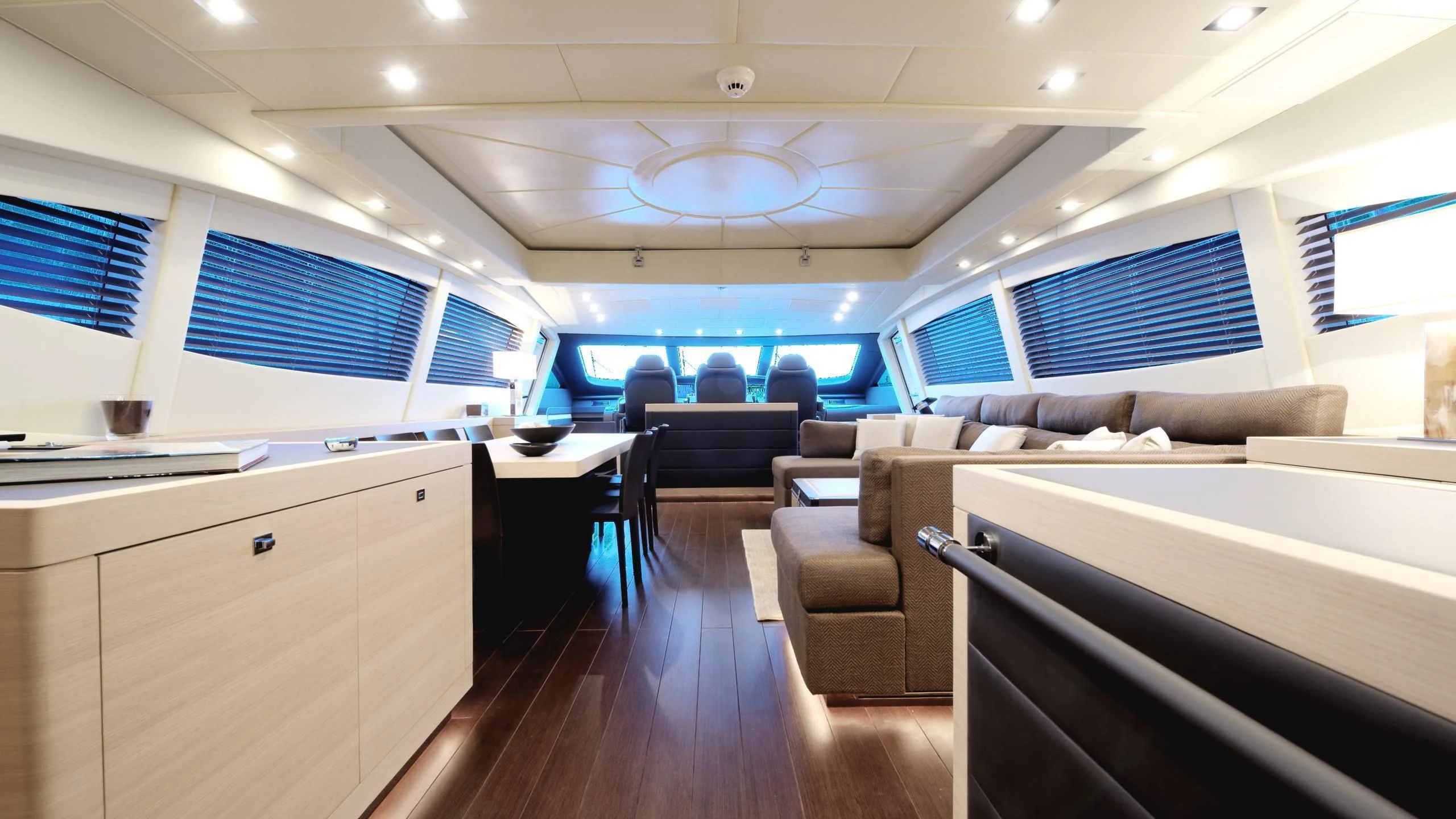 a room with a couch and a table and a window aboard CLARISSA Yacht for Sale