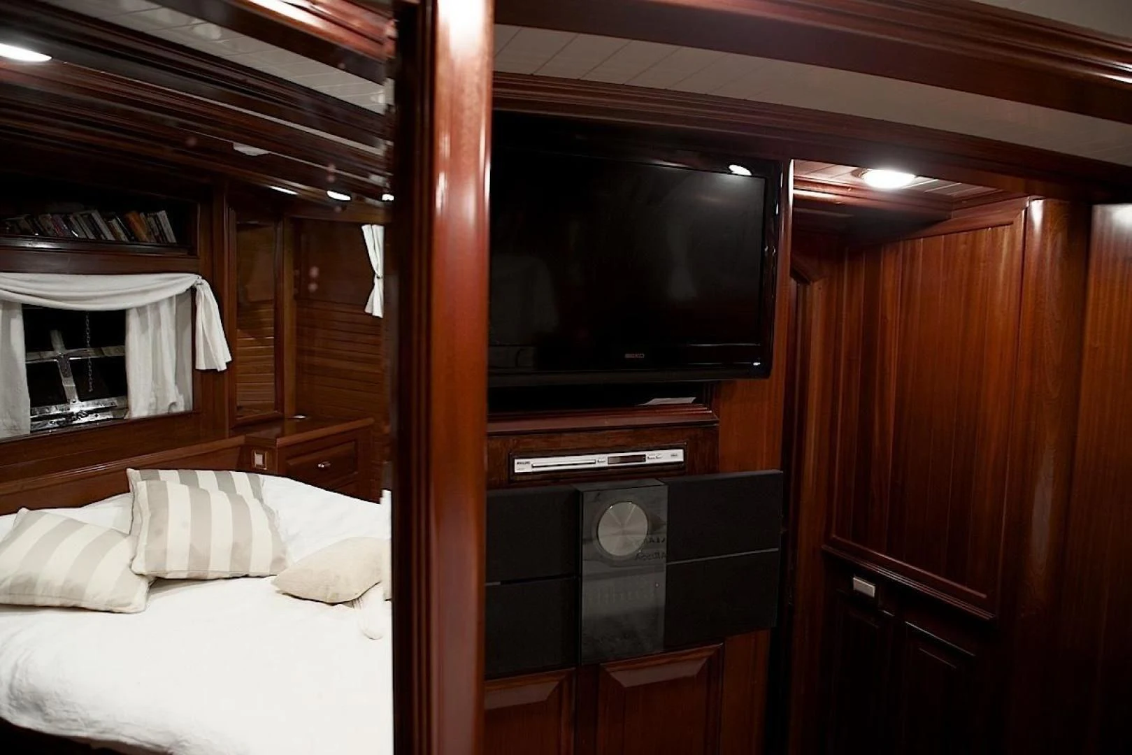 a room with a television and a bed aboard CLARISSA Yacht for Sale