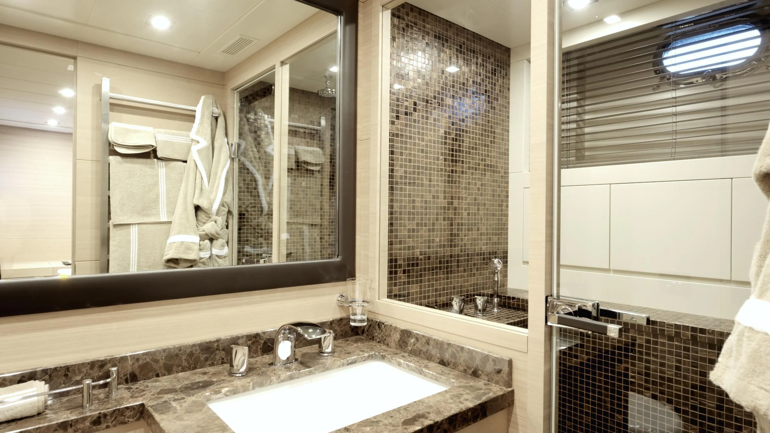 a bathroom with a sink and a mirror aboard CLARISSA Yacht for Sale