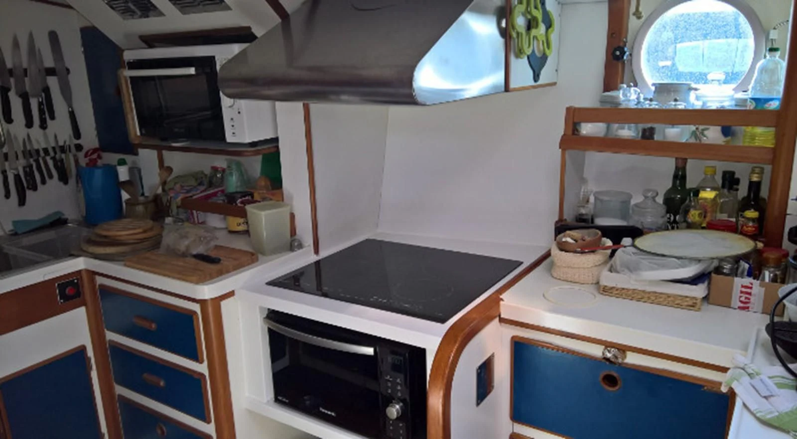 a kitchen with a stove and cabinets aboard ACOA Yacht for Sale